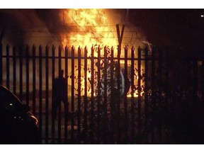 This image made from video shows a burning helicopter in a parking lot outside the King Power Stadium in Leicester, England shortly after a Premier League game on Saturday, Oct. 27, 2018. (Pool Photo via AP)