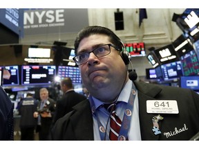 Trader Michael Capolino works on the floor of the New York Stock Exchange, Monday, Oct. 15, 2018. Stocks are opening mostly lower as technology companies continue to fall.