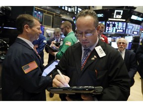 Trader Robert Arciero works on the floor of the New York Stock Exchange, Monday, Oct. 22, 2018. U.S. stocks veered broadly lower in early trading Monday as losses in health care companies and banks outweighed gains elsewhere.