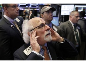 Trader Peter Tuchman works on the floor of the New York Stock Exchange, Thursday, Oct. 11, 2018. The market's recent decline was set off by a sharp drop in bond prices and a corresponding increase in yields last week and early this week.