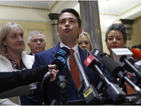 New Zealand opposition leader Simon Bridges speaks to reporters on Tuesday, Oct. 16, 2018, in Wellington, New Zealand. New Zealand's conservative opposition party was in turmoil after one of its own lawmakers, Jami-Lee Ross, accused Bridges of corruption for hiding a donation from a wealthy Chinese businessman.