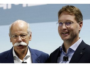Ola Kallenius, right, member of the Board of Management of Daimler AG. Group Research & Mercedes-Benz Cars Development, and Dieter Zetsche, Chairman of the Board of Management of Daimler AG, Head of Mercedes-Benz Cars, poses after a media preview at the Auto show in Paris, France, Tuesday, Oct. 2, 2018, 2018.