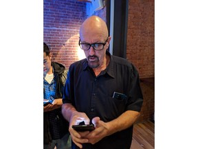 In this Oct. 16, 2018, photo Red founder Jim Jannard listens during an event in New York. Red's new Hydrogen One has a holographic screen that produces 3-D visuals without needing special glasses. It is launching with two major movies converted to this format and allows users to create and share their own videos shot with the phone. Jannard said his phone is about making waves in a sea of smartphone sameness.
