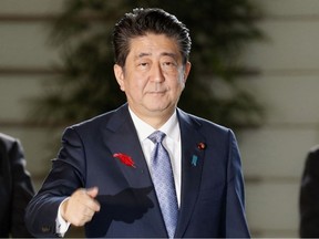 Abe is scheduled to reshuffle his Cabinet after his re-election as president of the ruling party, retaining key diplomatic and economy posts for continuity as Japan tackles challenging trade talks with the U.S.