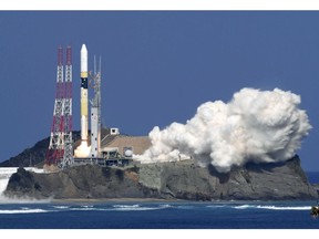 Japan's rocket H-2A is launched, carrying aboard a green gas observing satellite "Ibuki-2"  and KhalifaSat, a UAE satellite, Tanegashima, southern Japan, Monday, Oct. 29, 2018. The Japanese rocket carrying United Arab Emirates' first locally-made satellite has successfully lifted off from a space center in southern Japan.