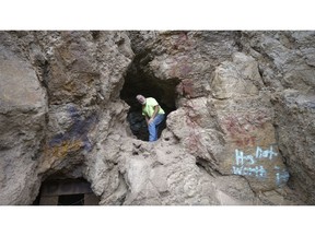 In this Aug. 11, 2018, photo, Bill Powell travels in to a mine near Eureka, Utah. He searched similar mines for months before his 18-year-old son Riley and girlfriend Brelynne Otteson were found dead in a shaft in March. During the search, he formed friendships with mine explorers who volunteered to help. Despite his painful memories, Powell decided to see what draws them there.