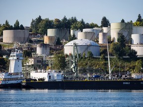 A double-hulled tanker sits docked in front of the Burnaby Refinery, operated by Parkland Fuel Corp., in Burnaby, British Columbia.