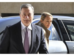 European Central Bank President Mario Draghi, left, arrives for a meeting of eurogroup finance ministers at the European Council building in Luxembourg, Monday, Oct. 1, 2018.