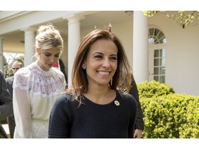FILE - In this April 5, 2017 file photo, then White House Senior Counselor for Economic Initiatives Dina Powell, followed by Ivanka Trump, leaves a news conference in the Rose Garden at the White House in Washington. President Donald Trump says former aide Dina Powell is under consideration to replace departing U.N. Ambassador Nikki Haley.  Powell served as deputy national security adviser to Trump for most of his first year in the White House, departing in mid-January. She previously worked for Goldman Sachs and served in President George W. Bush's administration.  Trump told reporters Tuesday that he has heard his daughter Ivanka Trump's name discussed for the post. He says she'd be "incredible" in the role, but he knows if he selected her, he'd be accused of nepotism.