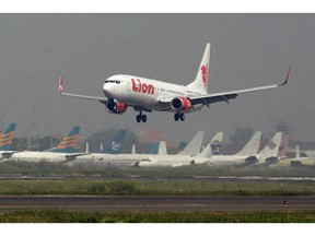 FILE - In this May 12, 2012 file photo, a Lion Air passenger jet takes off from Juanda International Airport in Surabaya, Indonesia. Indonesia's Lion Air said Monday, Oct. 29, 2018, it has lost contact with a passenger jet flying from Jakarta to an island off Sumatra.