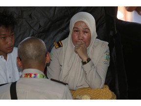 A relative of a passenger of a Lion Air plane cries while waiting for update on the plane that crashed off Java Island, at Tanjung Priok Port in Jakarta, Indonesia Monday, Oct. 29, 2018. A Lion Air flight crashed into the sea just minutes after taking off from Indonesia's capital on Monday in a blow to the country's aviation safety record after the lifting of bans on its airlines by the European Union and U.S.
