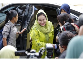Rosmah Mansor, center, wife of Malaysian Prime Minister Najib Razak, arrives at the Anti-Corruption Agency for questioning in Putrajaya, Wednesday, Oct. 3, 2018. Rosmah is to be questioned by the country's anti-graft agency for the third time as investigators prepare possible charges against her including money laundering in the multi-billion-dollar scandal.