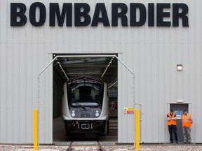 An Aventra Class 345 electric multiple-unit test train, manufactured by Bombarider Inc., sits on tracks in a hangar at the Bombardier Transportation UK Ltd.