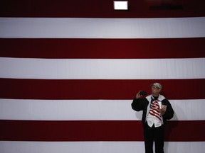 A Trump supporter takes a photo before a rally Friday in Indianapolis.