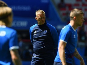 Iceland's manager Heimir Hallgrimsson, centre, watches his players during their training session this summer before their 2018 World Cup match against Argentina.