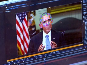 This image made from video of a fake video featuring former President Barack Obama shows elements of facial mapping used in new technology that lets anyone make videos of real people appearing to say things they've never said.