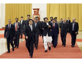 Pakistan's Prime Minister Imran Khan arrives to meet Chinese President Xi Jinping (not pictured) at the Great Hall of the People in Beijing, Friday, Nov. 2, 2018.