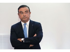 FILE - In this Oct. 6, 2017, file photo, Renault and Nissan Motor Co.'s chairman Carlos Ghosn listens during a media conference outside Paris, France. Nissan Motor Co. says an internal investigation found that its chairman, Carlos Ghosn, has underreported his income. The auto company said he will be dismissed.