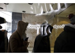 Google Canada employees return to the Google office in Toronto following a walkout in Toronto on Thursday, Nov. 1, 2018.