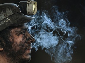 A coal miner in Romania. Coal prices are rising right now.