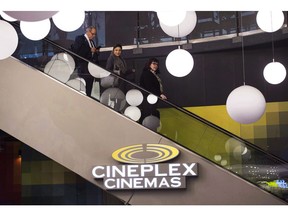 People leave a Cineplex theatre in Toronto on Friday, November 4, 2016. Cineplex Inc. reported its third-quarter profit fell compared with a year ago as revenue increased 4.4 per cent, boosted by gains at the box office and concession stands.