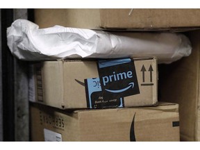 A package from Amazon Prime is loaded for delivery on a UPS truck, in New York on May 9, 2017. Amazon will split its second headquarters between Long Island City in New York and Crystal City in northern Virginia, according to a person familiar with the plans.