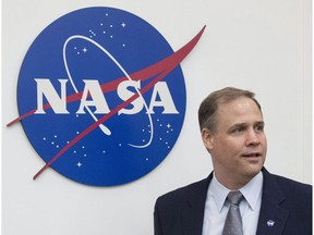 Administrator of the National Aeronautics and Space Administration (NASA) Jim Bridenstine enters the hall before a news conference at the U.S. embassy in Moscow in Moscow, Russia, Friday, Oct. 12, 2018. The head of the U.S. space agency says he wants to see Canadian astronauts walking on the moon in the not too distant future as part of a first step towards deeper exploration of the far reaches of space.