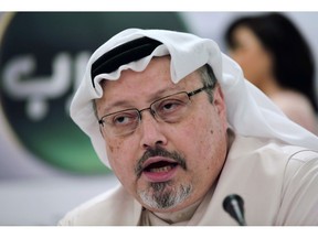 In this Feb. 1, 2015 file photo, Saudi journalist Jamal Khashoggi speaks during a news conference in Manama, Bahrain.The federal government is showing no apparent signs of toughening its stance on arms sales to Saudi Arabia, even after Canada's spy chief heard a recording of the killing of journalist Jamal Khashoggi.