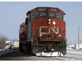 A Canadian National locomotive is shown in Montreal on February 23, 2015. Canadian National Railway Co. is laying off some non-unionized workers, barely two weeks after the company reported the highest quarterly revenues in its 99-year history.THE CANADIAN PRESS/Ryan Remiorz
