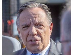 Francois Legault speaks to the media after casting his ballot Monday, October 1, 2018 in L'Assomption, Que. Legault is appearing to suggest a boycott of paint manufacturer Sico, which announced today it will pack its buckets for Ontario.THE CANADIAN PRESS/Ryan Remiorz