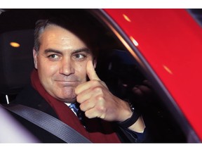 CNN's Jim Acosta gestures as he leaves federal court in Washington, Wednesday, Nov. 14, 2018, following a hearing on a legal challenge against President Donald Trump's administration over the revocation of his White House "hard pass."