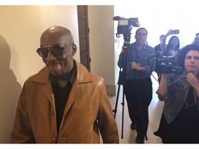 FILE - In this Oct. 10, 2018 file photo, plaintiff DeWayne Johnson, a school groundskeeper who says Roundup weed-killer caused his cancer, leaves a courtroom in San Francisco. Agribusiness giant Monsanto is appealing a $78 million verdict in favor of a dying California man who said the company's widely used Roundup weed killer was a major factor in his cancer. The company filed a notice of appeal Tuesday, Nov. 20, 2018, in San Francisco Superior Court challenging the August jury verdict in favor of Johnson.