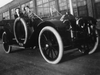 Two women drive alongside the General Motors Oshawa plant, circa 1933.