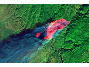 This Thursday, Nov. 8, 2018, satellite image provided by geology professor Jeff Chambers at the University of California, Berkeley, shows a short-wave infrared (red) image captured by Landsat 8 showing the full extent of the actively burning area of the Camp Fire about four hours after it started over the town of Paradise, Calif. The red patches are fires that leapfrogged in front of the primary burn front, which was growing at a rate of approximately 3 mph (5 kph). Multiple deaths have been reported and hundreds are unaccounted for in the nation's deadliest wildfire in a century.