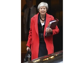 British Prime Minister Theresa May leaves 10 Downing Street, London, for the House of Commons to face Prime Minister's Questions, Wednesday, Nov. 28, 2018.