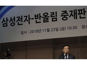 Kinam Kim, President & CEO, Device Solutions, Samsung Electronics apologizes in Seoul, South Korea, Friday, Nov. 23, 2018. Samsung Electronics has apologized for the sickness and deaths of some of its workers, saying it failed to create a safe working environment at its computer chip and display factories.