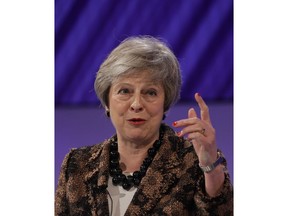 Britain's Prime Minister Theresa May delivers a speech at the CBI annual conference in London, Monday, Nov. 19, 2018. Theresa May said in a speech to business lobby group the Confederation of British Industry that the deal "fulfils the wishes of the British people" to leave the EU, by taking back control of the U.K.'s laws, money and borders.