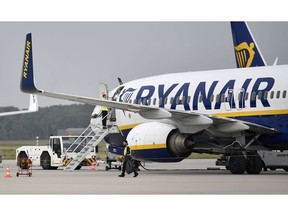 FILE - In this Wednesday, Sept. 12, 2018 file photo, a Ryanair jetplane parks at the airport in Weeze, Germany. French authorities have seized a Ryanair plane and forced 149 passengers to disembark because of a dispute over subsidies to the Irish airline. The French civil aviation authority announced Friday, Nov. 9 it had impounded the plane on the tarmac of the Bordeaux-Merignac airport as a "last resort."