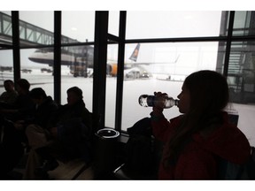 FILE - In this photo dated 2012, passengers wait for flights with flagship carrier Icelandair at Iceland's Trans-Atlantic hub, at Keflavik Airport, Iceland. The struggling low fair airline, Wow, was taken over by Iceland's flagship carrier, Icelandair, and Wow founder and CEO Skuli Mogensen urged his staff Monday Nov. 12, 2018, to "look at this as an opportunity to continue our journey now as a part of a much stronger group".