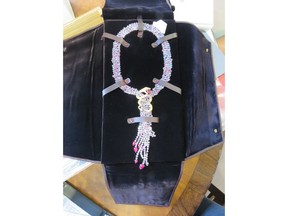 This photo made available by the National Crime Agency shows a sapphire and ruby serpent pendant, one of the 49 items of jewelry worth 400,000 pounds seized by Britain's National Crime Agency from Christie's auction house. The agency says they are linked to Zamira Hajiyeva, who is the subject of an investigation into the source of her wealth. Zamira Hajiyeva, a woman from Azerbaijan, whose fortune has been targeted by British authorities under anti-corruption laws was freed on bail Thursday while she battles extradition to her homeland over embezzlement allegations. (National Crime Agency via AP)