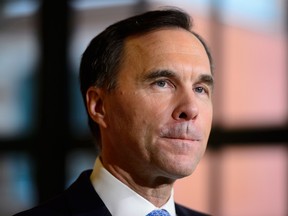 inance Minister Bill Morneau holds a press conference in the media lockup for the fall economic update, in Ottawa on Wednesday, Nov. 21, 2018.