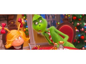 FILE - This file image released by Universal Pictures shows the characters Cindy-Lou Who, voiced by Cameron Seely, left, and Grinch, voiced by Benedict Cumberbatch, in a scene from "The Grinch." "Dr. Seuss' The Grinch" made off with $66 million for Universal Pictures to top the weekend North American box office, according to studio estimates Sunday, Nov 11, 2018.
