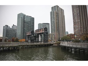 A former dock facility is shown with old transfer bridges, with "Long Island" painted in large letters at Gantry State Park in the Long Island City section of Queens, N.Y., Tuesday Nov. 13, 2018, in New York. Amazon announced Tuesday it has selected the Queens neighborhood as one of two sites for its headquarters.