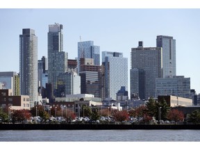 In this Wednesday, Nov. 7, 2018, photo, the Long Island City waterfront and skyline are shown in the Queens borough of New York. One of the areas that Amazon is considering for a headquarters is Long Island City. An old manufacturing area, it's cultivating a new image as a hub for 21st-century industry, creativity, and urbane living.