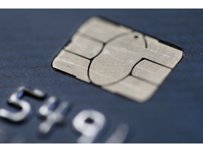FILE- This June 10, 2015, file photo shows a chip credit card in Philadelphia. On Wednesday, Nov. 7, 2018, the Federal Reserve releases its September report on consumer borrowing.