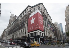 FILE- In this May 16, 2018, file photo, traffic makes it's way past the Macy's flagship store in New York. Macy's Inc. reports earnings Wednesday, Nov. 14.