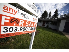 FILE- In this Oct 2, 2018, file photo a for sale sign stands outside a home on the market in the north Denver suburb of Thornton, Colo. On Thursday, Nov. 1, Freddie Mac reports on this week's average U.S. mortgage rates.