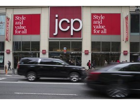 In this Wednesday, May 16, 2018, photo, traffic makes it's past the J.C. Penney logo hanging outside the Manhattan mall in New York. J.C. Penney Co. reports earnings on Thursday, Nov. 15.
