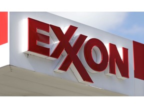FILE- This April 25, 2017, file photo, shows an Exxon service station sign in Nashville, Tenn. Exxon Mobil Corp. reports earnings Friday, Nov. 2, 2018.