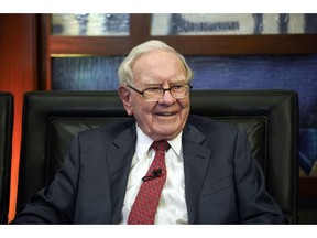 FILE- In this May 7, 2018, file photo, Berkshire Hathaway Chairman and CEO Warren Buffett smiles during an interview in Omaha, Neb., with Liz Claman on Fox Business Network's "Countdown to the Closing Bell." Berkshire Hathaway Inc. reports earnings Saturday, Nov. 3.